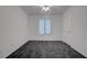 Bedroom with neutral colored walls, neutral carpeting, natural light and a closet at 4751 Lone Grove Dr, Las Vegas, NV 89139