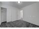 Bedroom with ample closet space and neutral carpet, offering comfort and convenience at 4751 Lone Grove Dr, Las Vegas, NV 89139