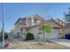 Inviting two-story home featuring a well-maintained front yard and a two-car garage at 4751 Lone Grove Dr, Las Vegas, NV 89139