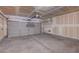 A spacious two car garage with gray door and concrete floor ready for customization at 4751 Lone Grove Dr, Las Vegas, NV 89139