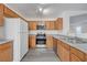 Well-lit kitchen featuring wooden cabinets, modern appliances, and granite countertops at 4751 Lone Grove Dr, Las Vegas, NV 89139