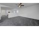 Open loft space features neutral walls, plush carpeting, and a view of staircase at 4751 Lone Grove Dr, Las Vegas, NV 89139