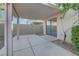 Spacious covered patio with concrete flooring and access to the house through sliding glass doors at 4751 Lone Grove Dr, Las Vegas, NV 89139