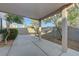 Covered patio area perfect for outdoor lounging, surrounded by trees at 4751 Lone Grove Dr, Las Vegas, NV 89139