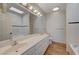 Bright bathroom features double sinks and a skylight at 483 Marina Cv, Boulder City, NV 89005