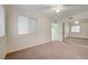 This bedroom features carpet flooring, a ceiling fan, and lots of natural light at 483 Marina Cv, Boulder City, NV 89005