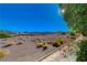 Picturesque desert view with native plants and flowers in the foreground at 483 Marina Cv, Boulder City, NV 89005