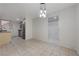A dining room with tile flooring leads into a kitchen, bathroom and closet area at 483 Marina Cv, Boulder City, NV 89005
