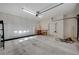 Spacious garage with painted floors, ample storage cabinets, overhead lighting, and garage door at 483 Marina Cv, Boulder City, NV 89005