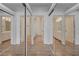 Hallway with mirrored closet doors leading to bathroom at 483 Marina Cv, Boulder City, NV 89005