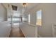 Bright hallway with wood floors, skylight, and views of the desert mountains at 483 Marina Cv, Boulder City, NV 89005