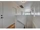 A well lit hallway with a staircase leading down to the lower level of the home at 483 Marina Cv, Boulder City, NV 89005