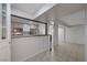 A kitchen features an open serving bar, appliances, and access to a large living space at 483 Marina Cv, Boulder City, NV 89005