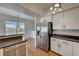 Bright kitchen with stainless appliances, white cabinets, and views at 483 Marina Cv, Boulder City, NV 89005