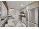This kitchen features stainless steel appliances, light wood cabinets and tile flooring at 483 Marina Cv, Boulder City, NV 89005