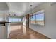 Open-concept living space with wood floors, large windows, and a modern light fixture at 483 Marina Cv, Boulder City, NV 89005