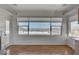 Bright living room features large windows offering abundant natural light and beautiful lake views at 483 Marina Cv, Boulder City, NV 89005