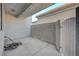 Covered patio featuring stucco walls, concrete flooring, and gated access to the yard at 483 Marina Cv, Boulder City, NV 89005