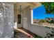 Inviting covered porch with mountain views, decorative hanging light, and house number displayed at 483 Marina Cv, Boulder City, NV 89005