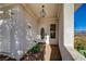 Front porch with a white door, hanging light fixture, and desert views at 483 Marina Cv, Boulder City, NV 89005