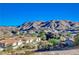 Mountain views and desert landscaping complement this community of homes with well-maintained grounds at 483 Marina Cv, Boulder City, NV 89005