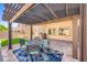 Outdoor covered patio with dining set at 5817 Pirate Ship Dr, North Las Vegas, NV 89031