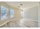 Bright bedroom with wood-look floors and natural light, creating a fresh and welcoming space at 5817 Pirate Ship Dr, North Las Vegas, NV 89031