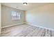 Bright, airy bedroom with wood-look floors and natural light, ready for your personal touch at 5817 Pirate Ship Dr, North Las Vegas, NV 89031