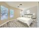 Cozy bedroom with natural light, neutral tones, and wood-look floors, providing a warm and inviting atmosphere at 5817 Pirate Ship Dr, North Las Vegas, NV 89031