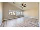Bright bedroom with wood floors and a large bay window at 5817 Pirate Ship Dr, North Las Vegas, NV 89031