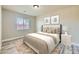 Well-appointed bedroom with a comfortable bed, neutral tones, and ample natural light, offering a relaxing retreat at 5817 Pirate Ship Dr, North Las Vegas, NV 89031