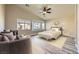 Staged bedroom with a bay window and ceiling fan at 5817 Pirate Ship Dr, North Las Vegas, NV 89031