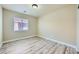 A well-lit bedroom with wood-look flooring at 5817 Pirate Ship Dr, North Las Vegas, NV 89031