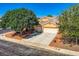 Charming single-story home with a two-car garage and mature trees in a well-kept neighborhood at 5817 Pirate Ship Dr, North Las Vegas, NV 89031