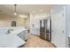 Bright kitchen with stainless steel appliances and a breakfast bar at 5817 Pirate Ship Dr, North Las Vegas, NV 89031