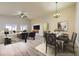 Bright, staged living room with hardwood floors, modern furnishings, and an adjacent dining area at 5817 Pirate Ship Dr, North Las Vegas, NV 89031