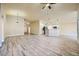 Bright, open concept living area with hardwood floors, neutral walls, kitchen, and dining at 5817 Pirate Ship Dr, North Las Vegas, NV 89031