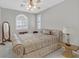 Bedroom featuring neutral walls, tile floors, ceiling fan, and plantation shutters at 5918 Terra Grande Ave, Las Vegas, NV 89122
