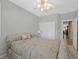 Bedroom featuring neutral walls, tile floors, ceiling fan, and a double-door closet at 5918 Terra Grande Ave, Las Vegas, NV 89122