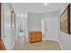 Well-lit foyer with neutral walls and a wooden cabinet at 5918 Terra Grande Ave, Las Vegas, NV 89122