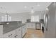 Bright kitchen with stainless steel appliances, granite countertops, and white cabinets at 5918 Terra Grande Ave, Las Vegas, NV 89122