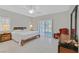 Serene bedroom featuring a ceiling fan, shutters, and a sliding glass door to the backyard at 5918 Terra Grande Ave, Las Vegas, NV 89122