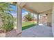 Covered patio looking out onto a backyard with artificial turf at 5918 Terra Grande Ave, Las Vegas, NV 89122