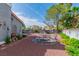 Beautiful backyard with a firepit, mature trees, and attractive landscaping, creating a serene outdoor space at 6536 Pleasant Plains Way, Las Vegas, NV 89108
