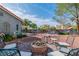 Charming backyard featuring a fire pit and outdoor seating, perfect for entertaining or enjoying quiet evenings at 6536 Pleasant Plains Way, Las Vegas, NV 89108