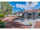 Backyard with patio, landscaping, shade umbrellas, and plenty of room for outdoor enjoyment at 6536 Pleasant Plains Way, Las Vegas, NV 89108
