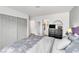 Bedroom featuring closet, en-suite bathroom, dresser, and a comfortable bed at 6536 Pleasant Plains Way, Las Vegas, NV 89108