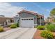 Charming single-story home with a two-car garage and well-maintained landscaping, enhancing curb appeal at 6536 Pleasant Plains Way, Las Vegas, NV 89108