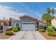Well-maintained single-story home featuring desert landscaping, an attached garage, and a red tile roof at 6536 Pleasant Plains Way, Las Vegas, NV 89108
