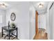 Hallway featuring wooden floors, a decorative table, and a sliding barn door at 6536 Pleasant Plains Way, Las Vegas, NV 89108